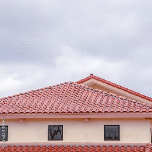 Square Tiled roof on a building with ventilation windows