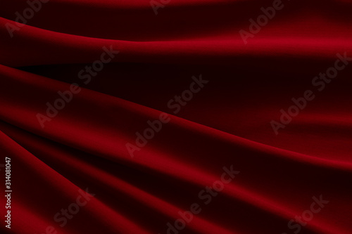 Red cloth waves background texture. © phadungsakphoto