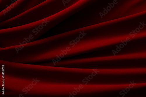 waves of red satin fabric as background