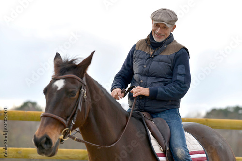 Portrait of horseman riding horse