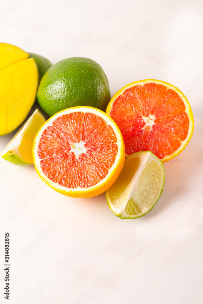 mango, lime and red orange on white mango, lime and red orange on white