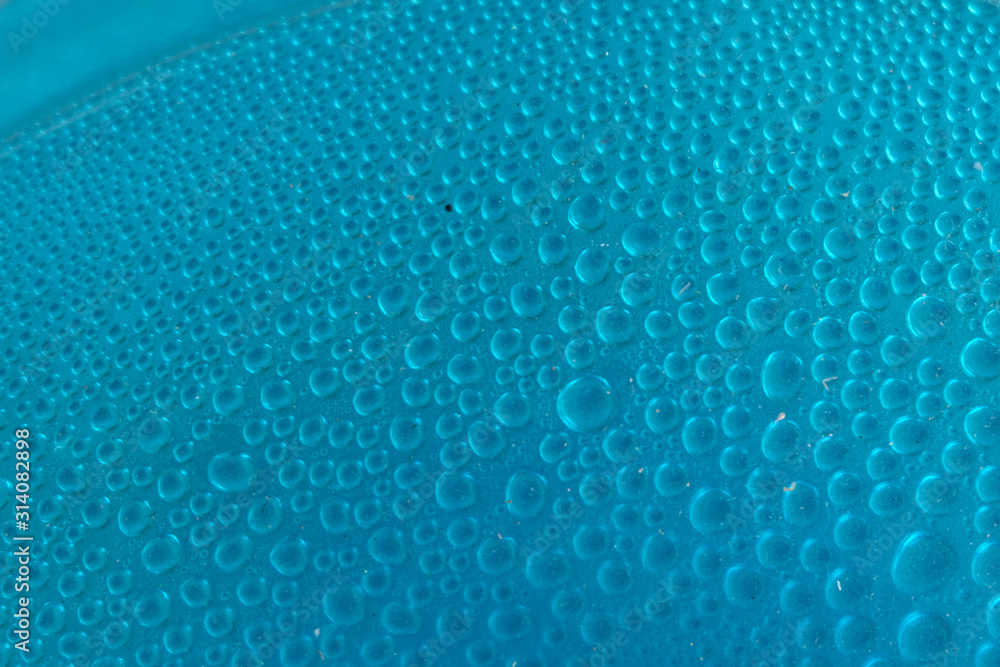 Blue water drops background close up Blue water drops background close up