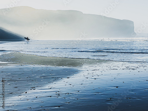 Arrifana beach surfer photo