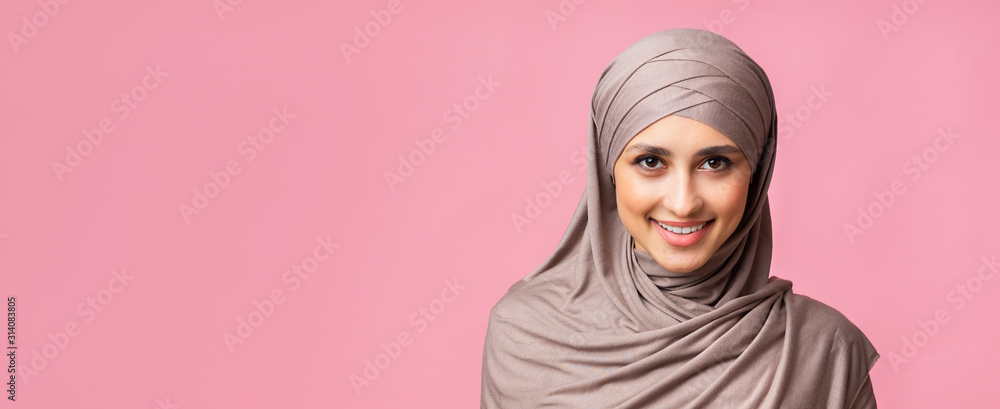Portrait of confident arabic girl in headscarf looking at camera Portrait of confident arabic girl in headscarf looking at camera