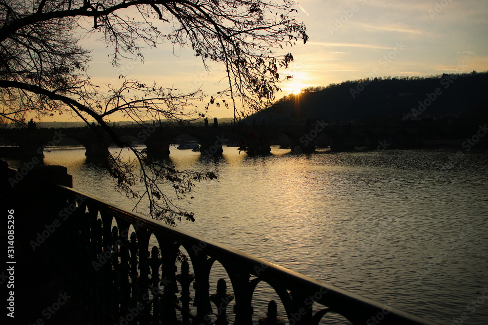 Prague and vltava river. Charles bridge view at sunset