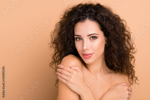 Close up photo beautiful she her lady smearing balm body shoulders skin healthy silky shiny ideal condition use new soap gel shower bath hold herself hands wearing no clothes isolated beige background
