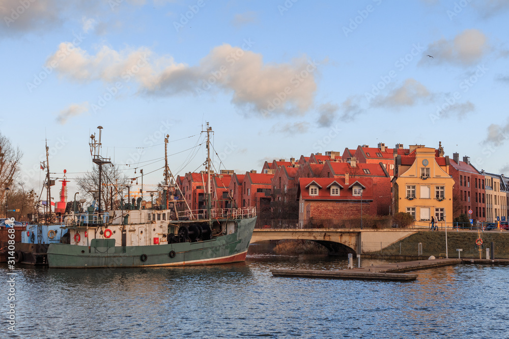 Gdansk city promenade in poland with beautiful old buildings and ships in winter