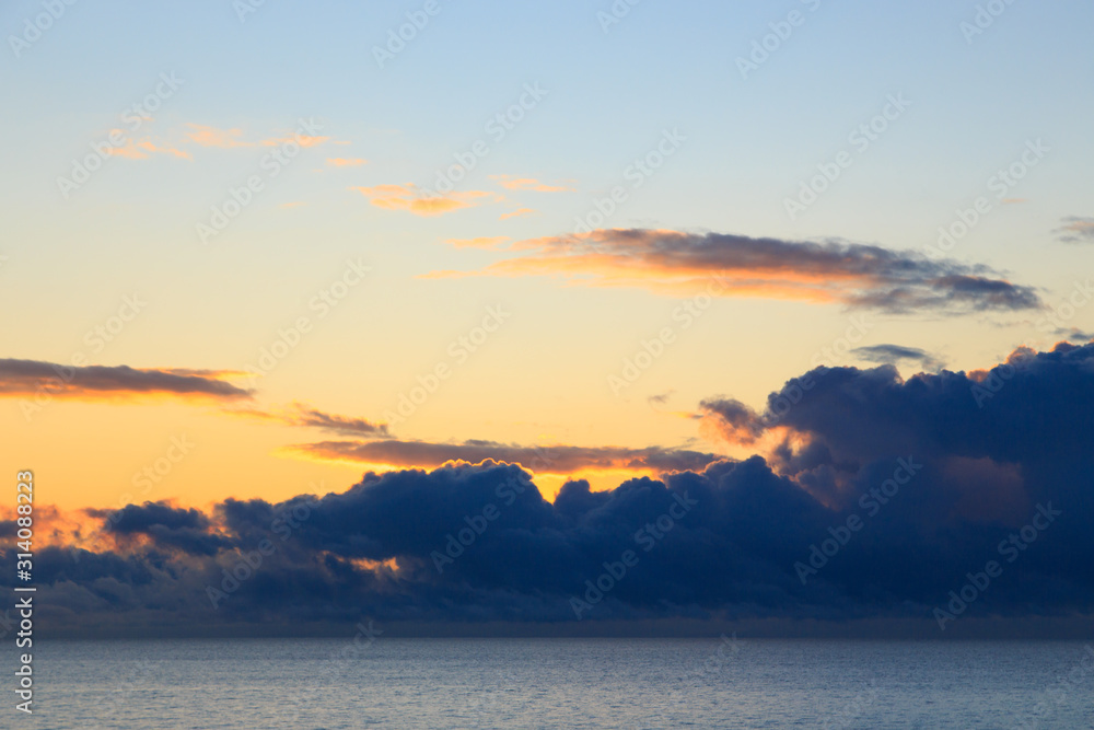 Bright cumulus clouds against the blue sky. Sunset sky Natural background. seascape Bright cumulus clouds against the blue sky. Sunset sky Natural background. seascape