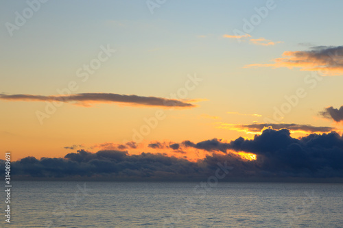 Bright cumulus clouds against the blue sky. Sunset sky Natural background. seascape