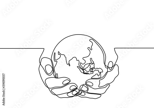 Hand holding earth globe on...