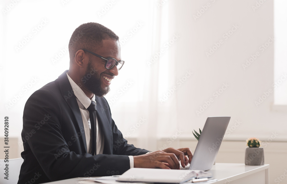 Black businessman working in modern high tech office Black businessman working in modern high tech office