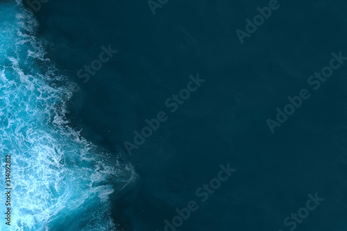 Aerial view to sea landscape, sea water with waves. Dramatic colors photo. Image with place for text.