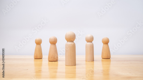 Outstanding people from crowd, group of teamwork wooden model, Leadership management concept