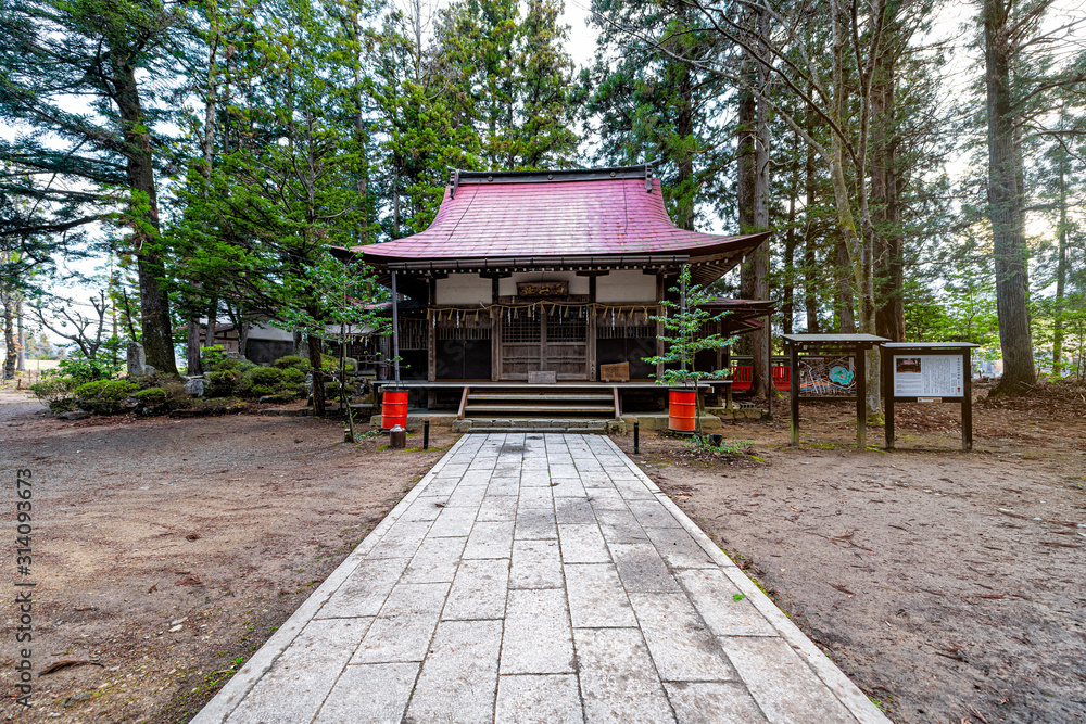 Takayama, Japan Higashiyama Hakusan Shrine in historical city in Gifu Prefecture during day by entrance to temple building Takayama, Japan Higashiyama Hakusan Shrine in historical city in Gifu Prefecture during day by entrance to temple building