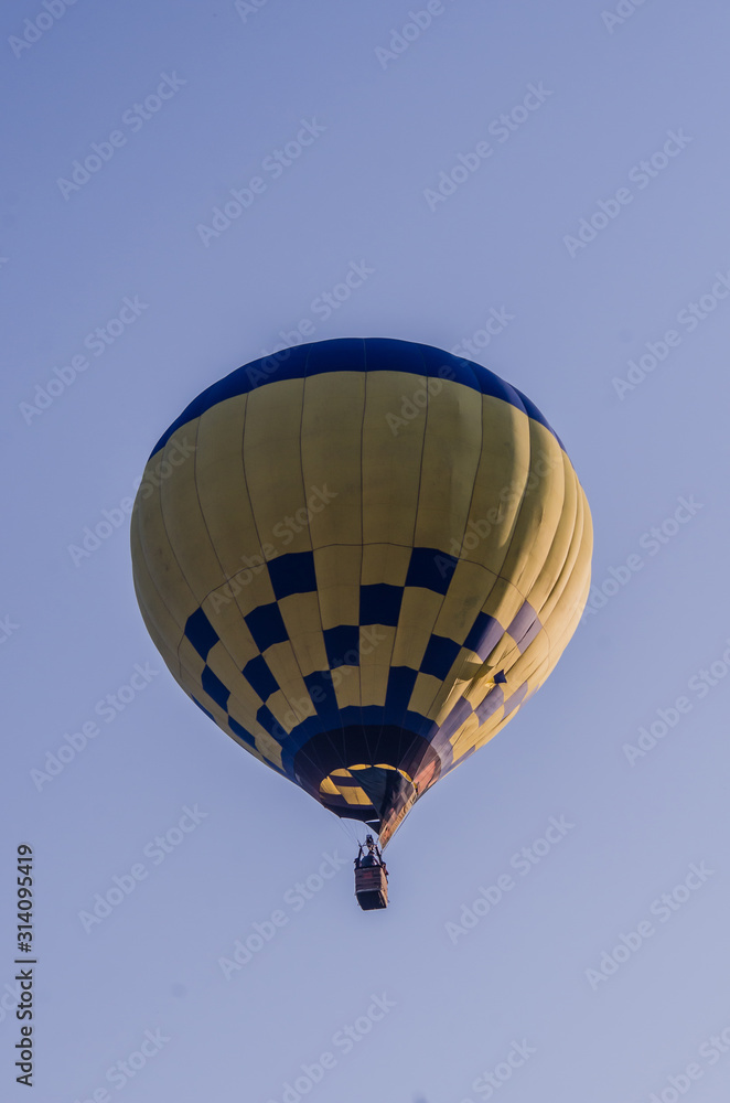 Fototapeta premium hot air balloon is flying at sunrise. romantic balloon flights