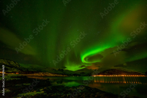 beautiful aurora borealis, polar lights, over mountains in the North of Europe - Lofoten islands, Norway