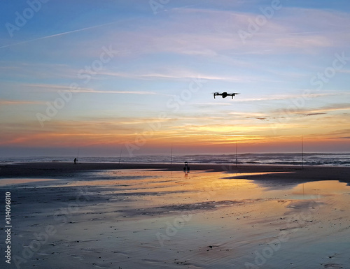 Drone flying at the beach at a beautiful sunset in Portugal © Nataraj