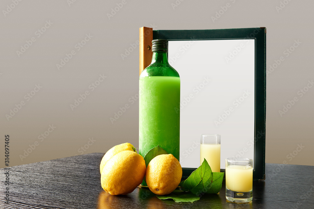 Bottle of lemoncello with glasses and order menu Bottle of lemoncello with glasses and order menu