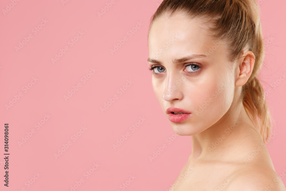 Obraz premium Close up blonde half naked woman 20s perfect skin nude make up blue eyes isolated on pastel pink wall background studio portrait. Skin care healthcare cosmetic procedures concept. Mock up copy space.