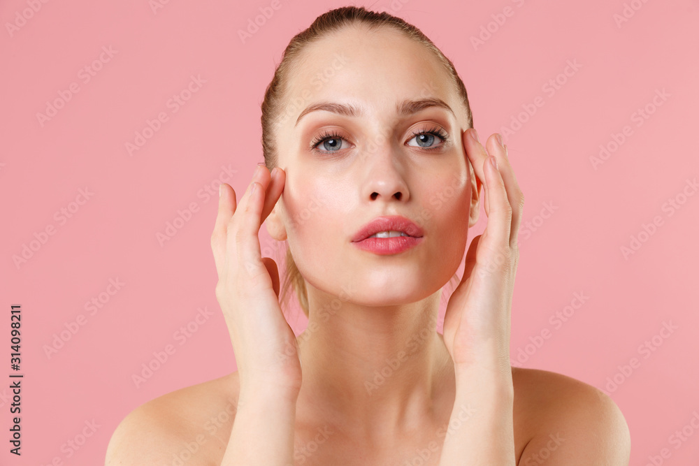 Close up blonde half naked woman 20s perfect skin nude make up blue eyes isolated on pastel pink wall background studio portrait. Skin care healthcare cosmetic procedures concept. Mock up copy space. Close up blonde half naked woman 20s perfect skin nude make up blue eyes isolated on pastel pink wall background studio portrait. Skin care healthcare cosmetic procedures concept. Mock up copy space.