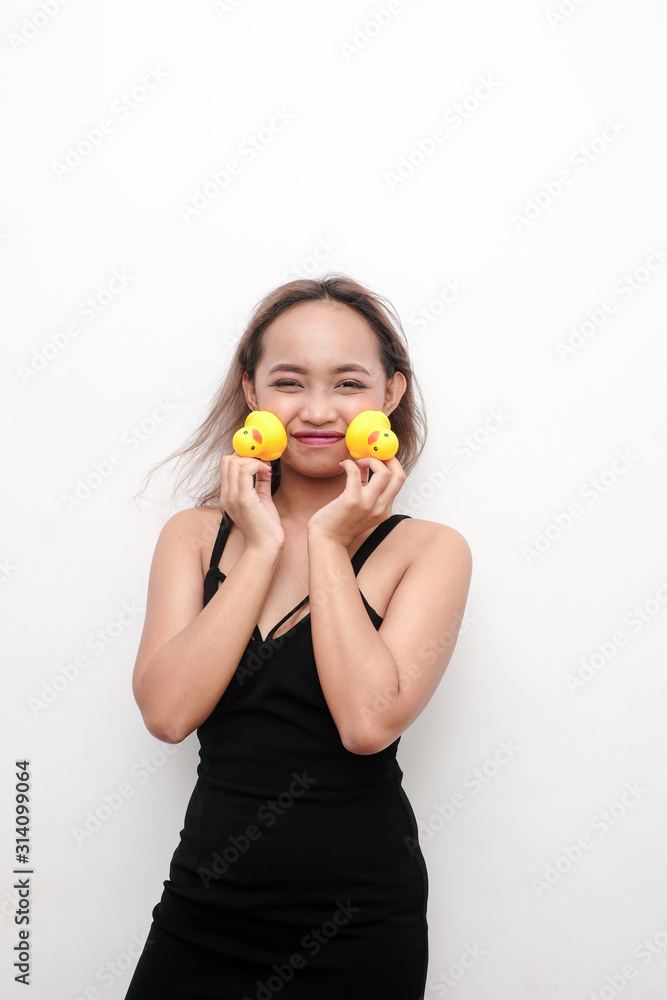 Young girl holding rubber duck in celebration of National Rubber duck day. Young girl holding rubber duck in celebration of National Rubber duck day.