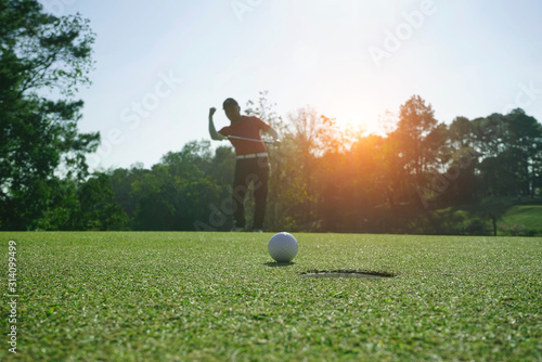 Golfer playing golf in beautiful golf course in the evening golf course with sunshine