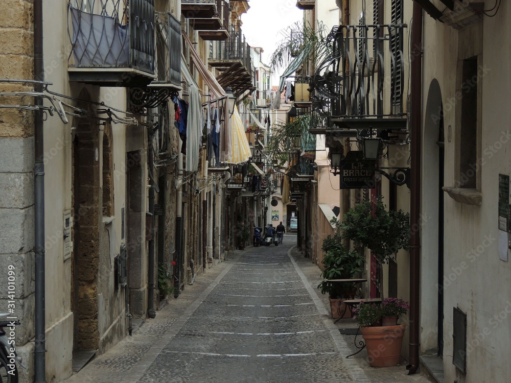 Cefalù – cityscape of a typical street between ancient buildings