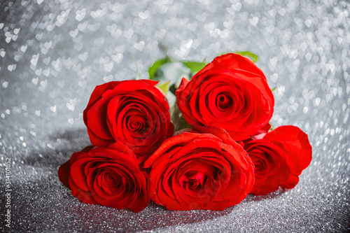 Red roses on heart bokeh background