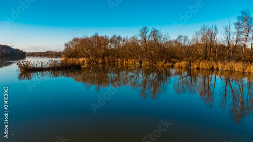 Beautiful autumn or indian summer view with reflections near Zeholfing, Isar, Bavaria, Germany