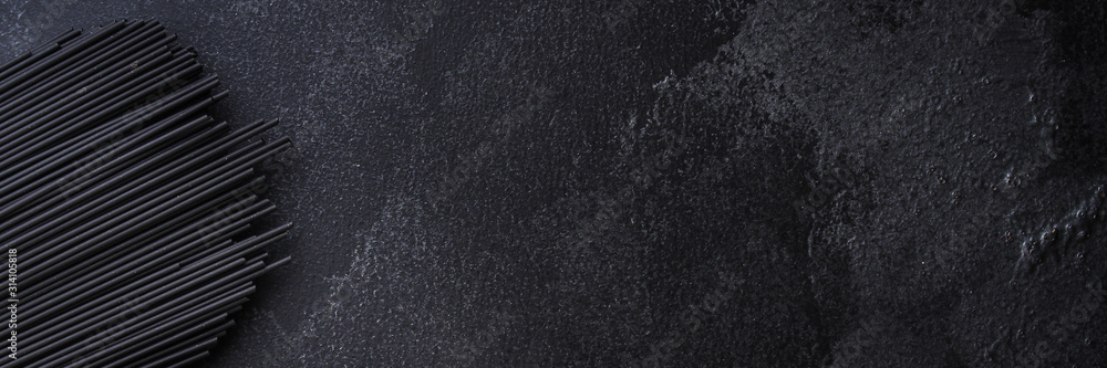 pasta spaghetti with cuttlefish ink (healthy eating, black color) menu concept. food background. top view. copy space
