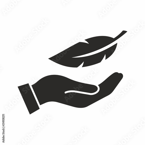 Feather in hand icon. Vector icon isolated on white background.