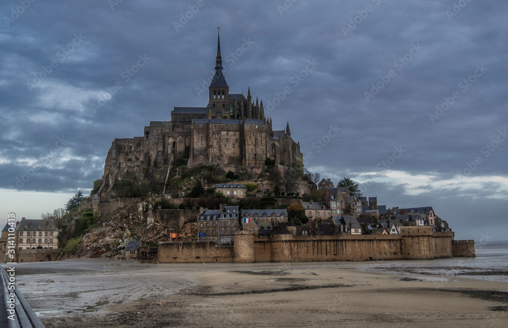 The magnificent medieval abbey of Mont Saint-Michel (France) exudes history, beauty and magic alike , Concept tourism.
