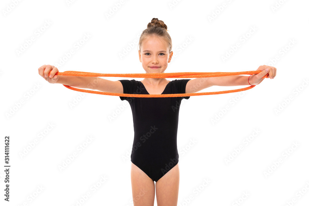 young gymnast girl doing stretching with elastic tape on a white background