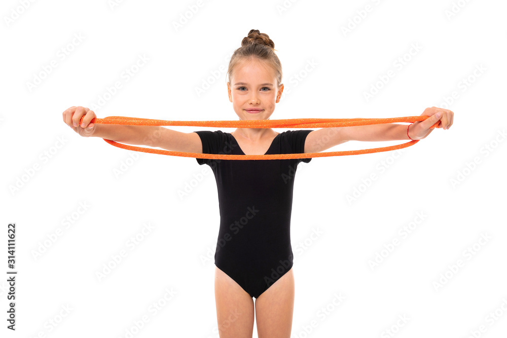young gymnast girl doing stretching with elastic tape on a white background young gymnast girl doing stretching with elastic tape on a white background