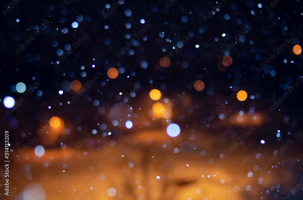 falling snow at night with bokeh effect
