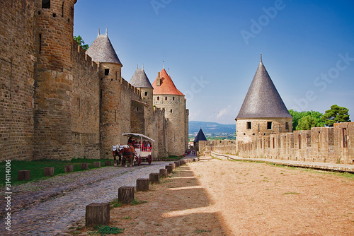 Walk between the walls of the fortress city of Carcassonne photo