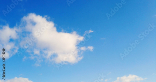 White clouds with blue sky background.