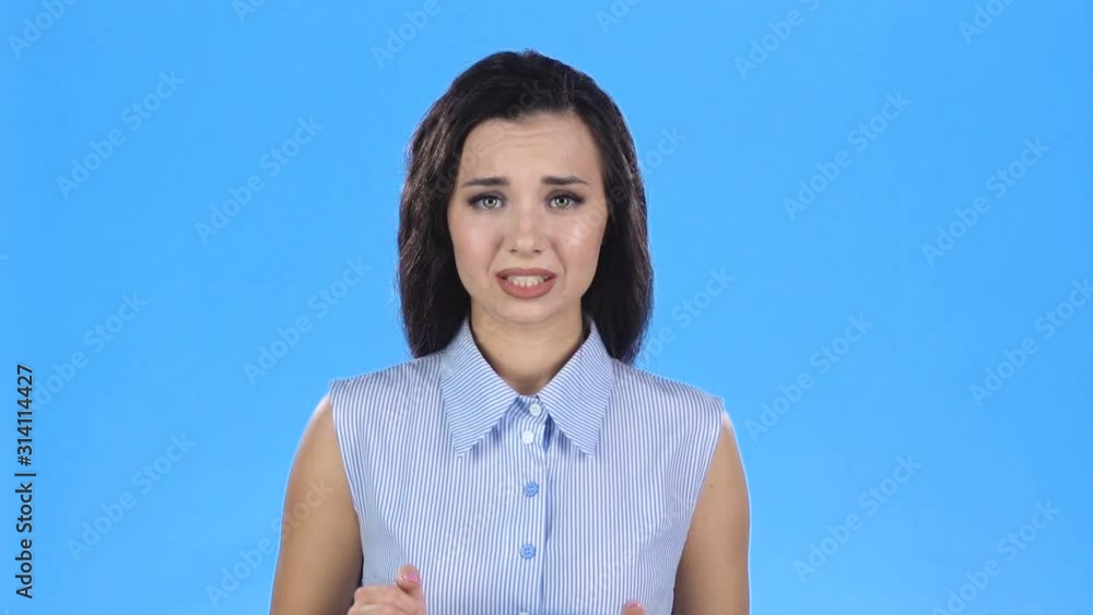 Pretty female is crossing fingers and then smiling and being very happy. Slow motion Pretty female is crossing fingers and then smiling and being very happy. Slow motion
