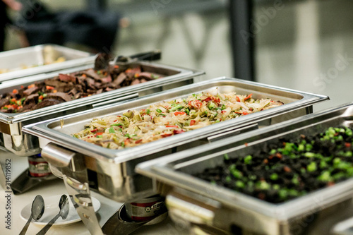 buffet food in chafing dishes at dinner event