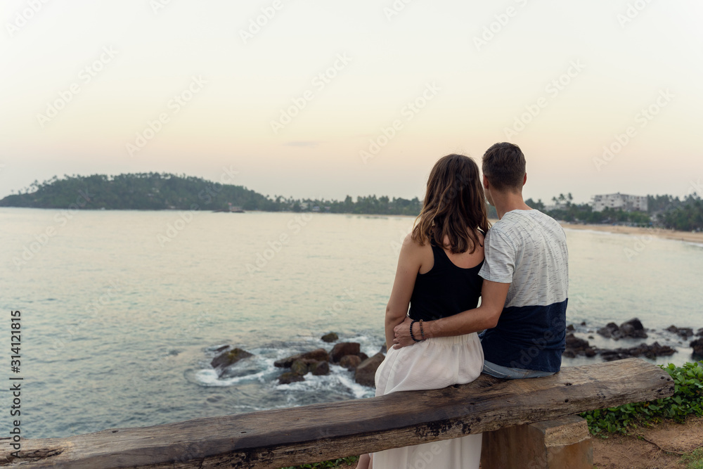 young couple looking at the Mirissa bay in Sri Lanka