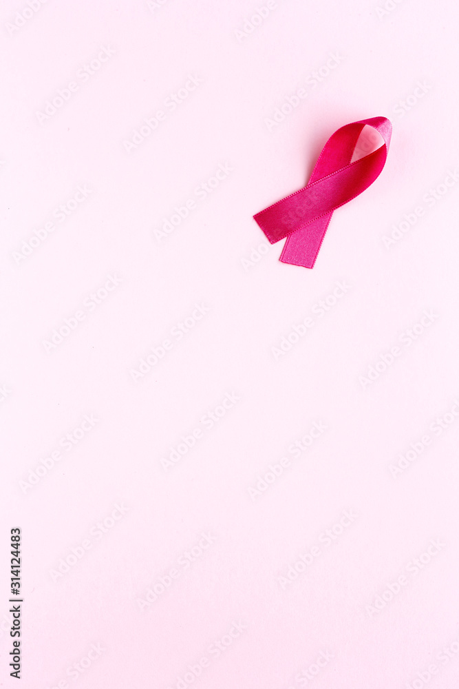 Obraz premium Pink ribbon on a colored background