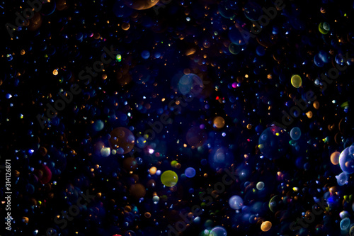 abstract bokeh background, colorful particles
