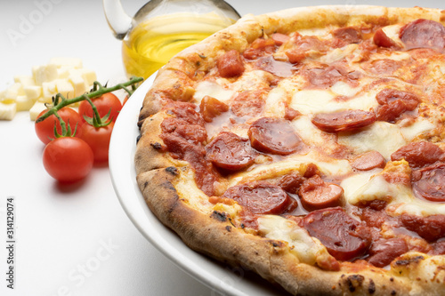pizza with salami on the white background