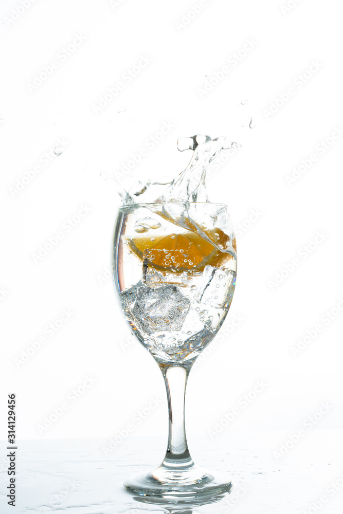 Mineral water with ice cubes and lemon slice Mineral water with ice cubes and lemon slice