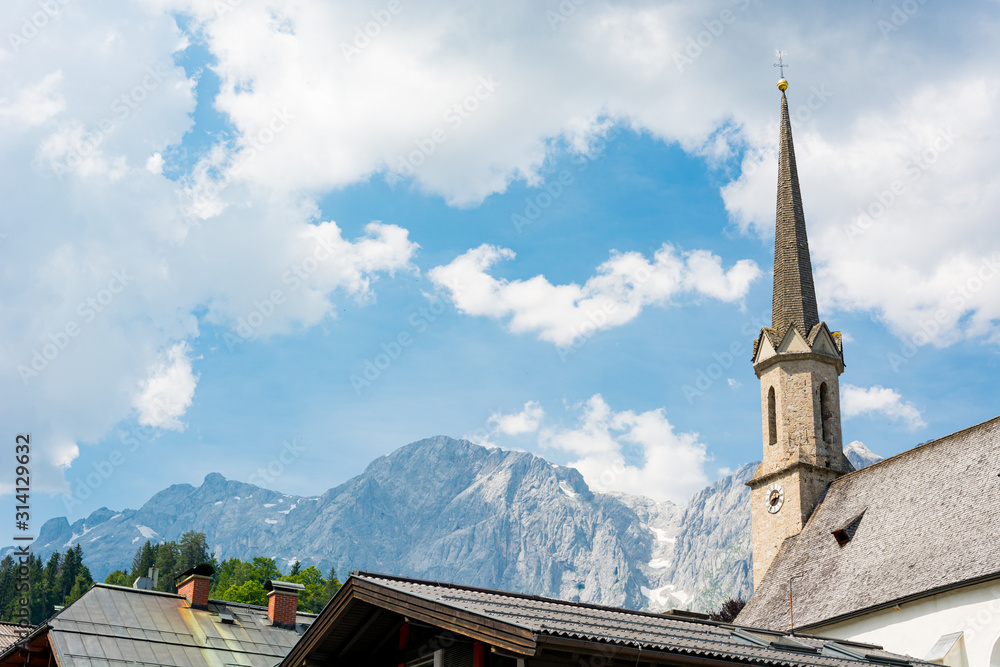 Old alpine church in picturesque mountain town.