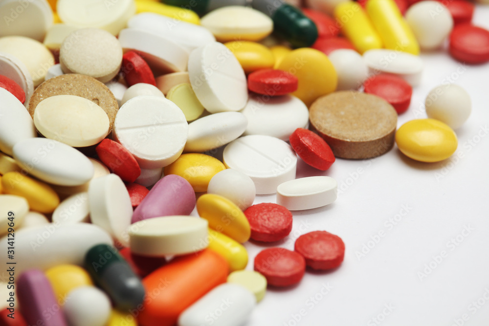 Different colorful tablets at white background Different colorful tablets at white background