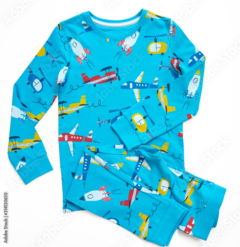 Sleepwear set for a toddler boy on white background. Shirt and pants made of blue pattern cotton fabric. Pajama for boy. Flat lay. Top view. 