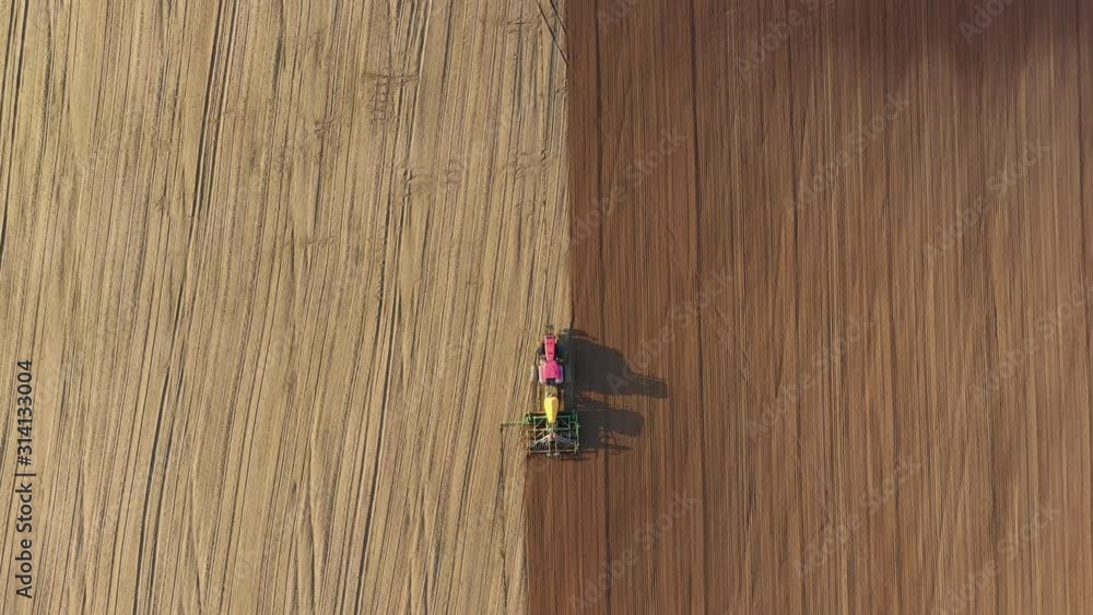 Tractor Plows And Seeder Plants Seeds Of Grain Crops In Agricultural Field Tractor Plows And Seeder Plants Seeds Of Grain Crops In Agricultural Field