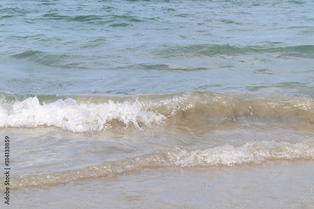 The ocean waves that blow into the beach at the time of clear sky The ocean waves that blow into the beach at the time of clear sky