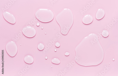 Obraz na płótnie drops of water spilled on a light pink surface w salonie